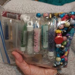 Bag stuffed with beads and more