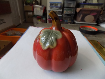 3 1/2 inch round dark orange ceramic pumpkin & leaf