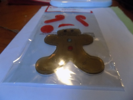 NIP window gel clings Gingerbread man in Santa hat, candy