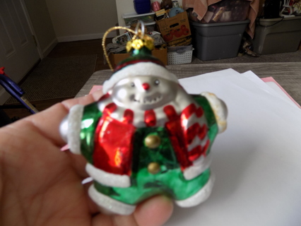 4 inch resin fat snowman ornament in green outfit and red coat