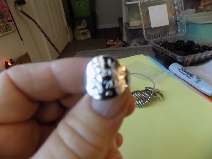 Silvertone ring says I survived 2020and has a woman in a mask size 9