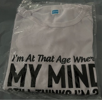 Brand New: White, Funny, Tee. Sz 2x.(23” Across. 28”L) “My Mind ..29..Humor..12…Body…Dead Yet"