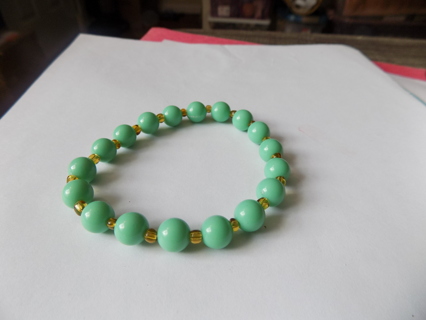 Bracelet large round Mint green beads with yellow E beads inbetween