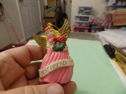 Vintage 1997 angel best friend ornament dressed in pink holds wreath