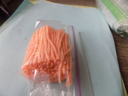 snack baggie full of peach hook latch yarn