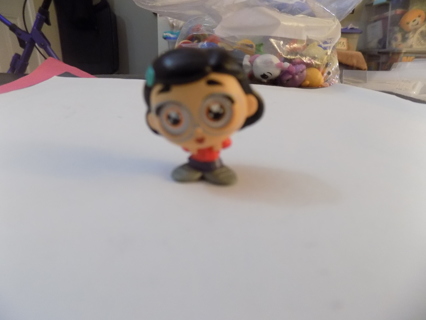 Disney;s doorable Little girl with black hair,blue hair barrette, red skirt