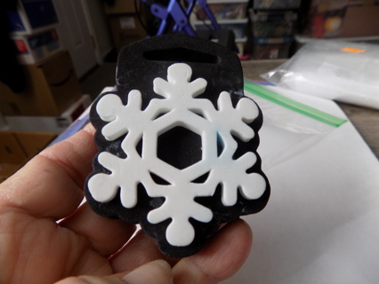 2 1/2 inch white snowflake foam stamp black background