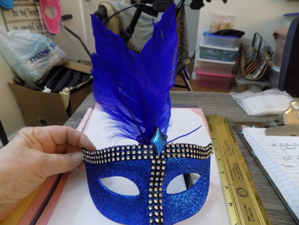 Blue glittery Mardi Gras mask with tall feathers & blue diamond jewel & 3 rows clear stones