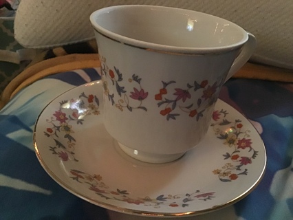 *tea cup & plate with alots of flowers*