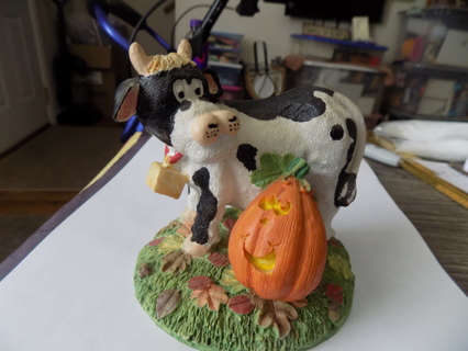Ceramic black and white cow with Jack a lantern 5 inch