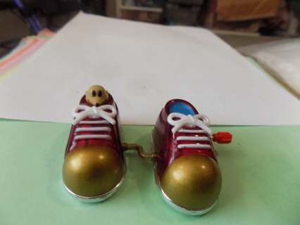 Z wind up sneakers with mouse inside them