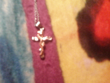 silver cross w/ gold rose on it