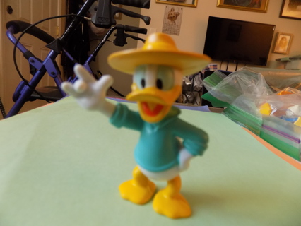 3 inch Donald Duck Pvc toy in yellow hat and aqua shirt