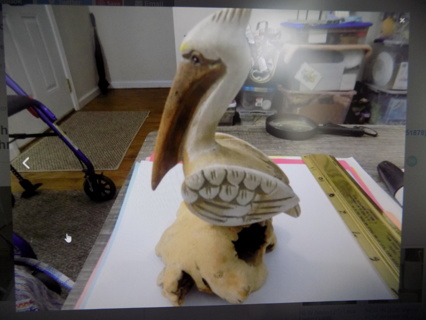6 inch hand carved pelican on dried mushroom base, unusual & detailed