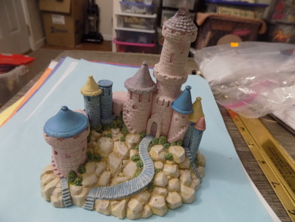 5 inch tall pastel shades resin castle on mountain winding stairs