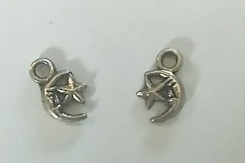 Two small star and moon silver tone charms