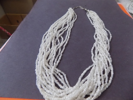 Necklace white multi strand clear and white E beads