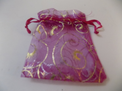 Purple organdy drawstring jewelry bag with gold swirls on it 3 x 2 1/2