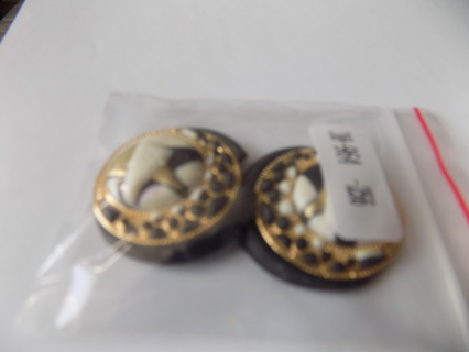 Pair of 1 1/4 inch round black, and gold, and white flat back embellishments domes