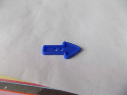 Large plastic blue arrow button