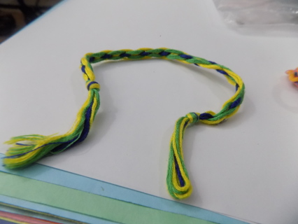 Home made woven thread friendship bracelet yellow, lime green and blue
