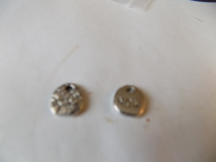 Pair of silvertone oval charms 1 embossed  1 says NOW great for earrings