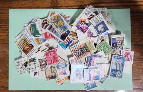 Over 100 Unsorted Used US Stamps