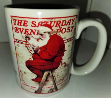 Norman Rockwell Saturday Evening Post cover "Santa in Pajamas" ceramic mug 4 1/2" high x 3" diameter