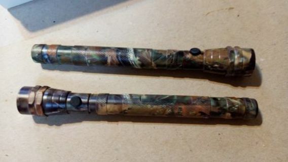 2- LED CAMOUFLAGE FLASHLIGHTS. BRAND NEW IN BOX. WITH BATTERIES... HIGH BIDDER WINS