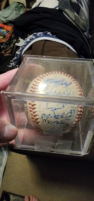 Unknown team autographed baseball came with baseball card collection