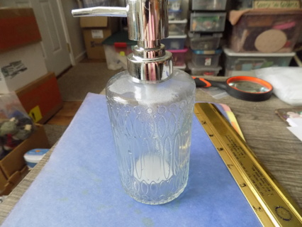 7 inch tall clear textured glass soap dispenser with silver top