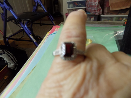 ring # 3 silvertone rectangle ruby glass stone, rows of clear accents and down side sz 7