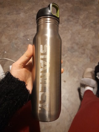 Metal water bottle by Stanley, with removable lid