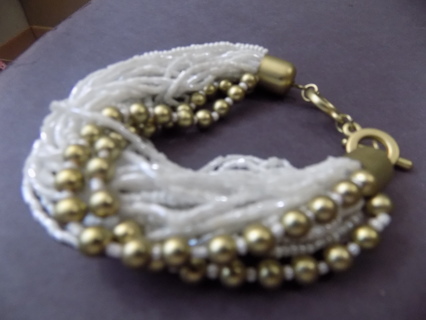 Bracelet multi strand clear and white # beads and gold beads on 2 strand