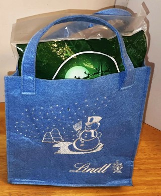 Small Christmas cloth bag by Lindt containing Frosty Show for a tree