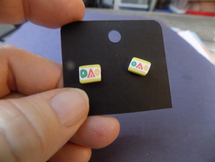 Yellow rectangle post earrings with green red,yellow shapes