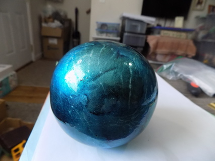 4 inch round heavy thick hand blown glass ornament aqua and green flat on bottom sits on shelf