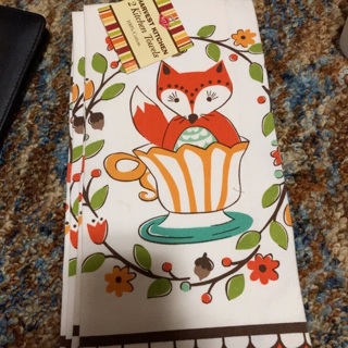 Two cotton dish towels with fox in a tea cup