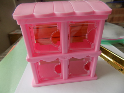 Pink plastic 4 door display shelf for a doll house 4 1/2 tall doors open