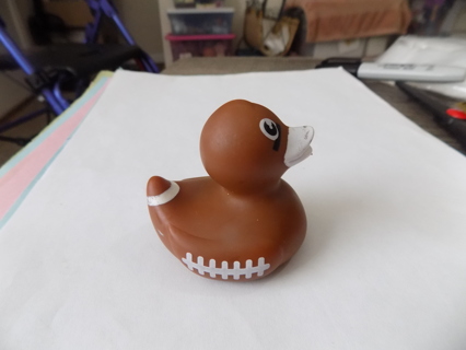 rubber duckie looks like a brown football