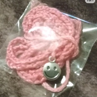 Pink cord smiley face charm necklace nip
