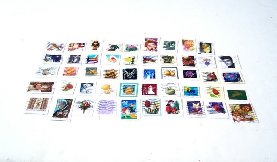 United States Postage Stamps Used Still on Paper