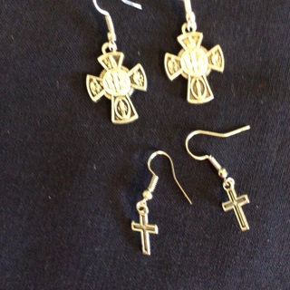 Two Sets of Dangling Cross Earrings .