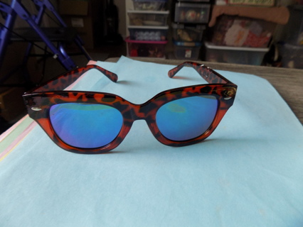 blue lens sunglasses in tortorise shell frame