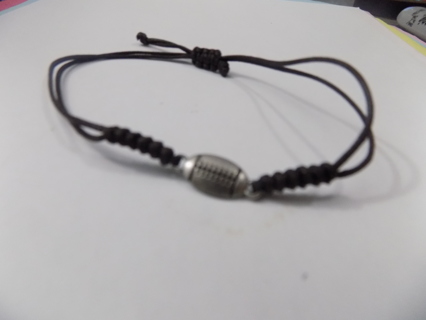 Adjustable black cord bracelet with silvertone football charm