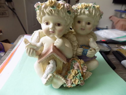 6 inch tall 2 angel cherubs music box detailed 1 is holding dove, the other seed