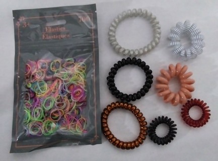 Plastic hair binders. 1 pack of 700 and 7 various coil, like new.