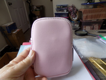 Pink arm band change purse zipos across top