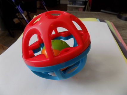 Interactive red and blue toddler ball with orange, green bell chime ball