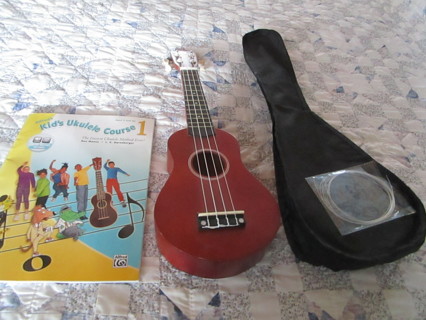 ukulele / book/ carry case / extra strings